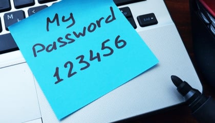 sticky note of someone's password on laptop 